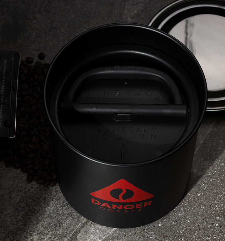 Lifestyle shot of Aeropress brewing Danger Coffee for fresh, mold-free clean energy