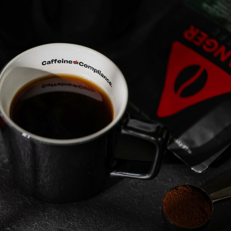 Lifestyle shot of Aeropress brewing Danger Coffee for fresh, mold-free clean energy