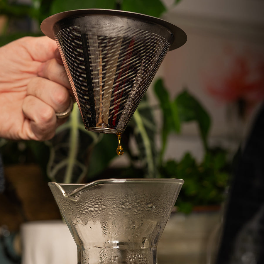 Lifestyle shot of Aeropress brewing Danger Coffee for fresh, mold-free clean energy