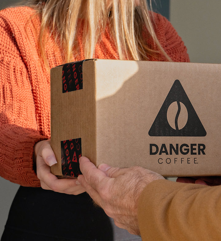 Lifestyle shot of Aeropress brewing Danger Coffee for fresh, mold-free clean energy