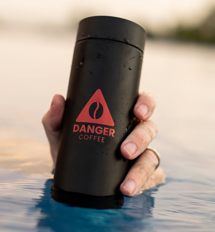 Lifestyle shot of Aeropress brewing Danger Coffee for fresh, mold-free clean energy