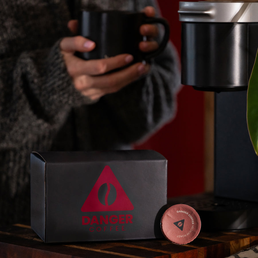 Lifestyle shot of Aeropress brewing Danger Coffee for fresh, mold-free clean energy
