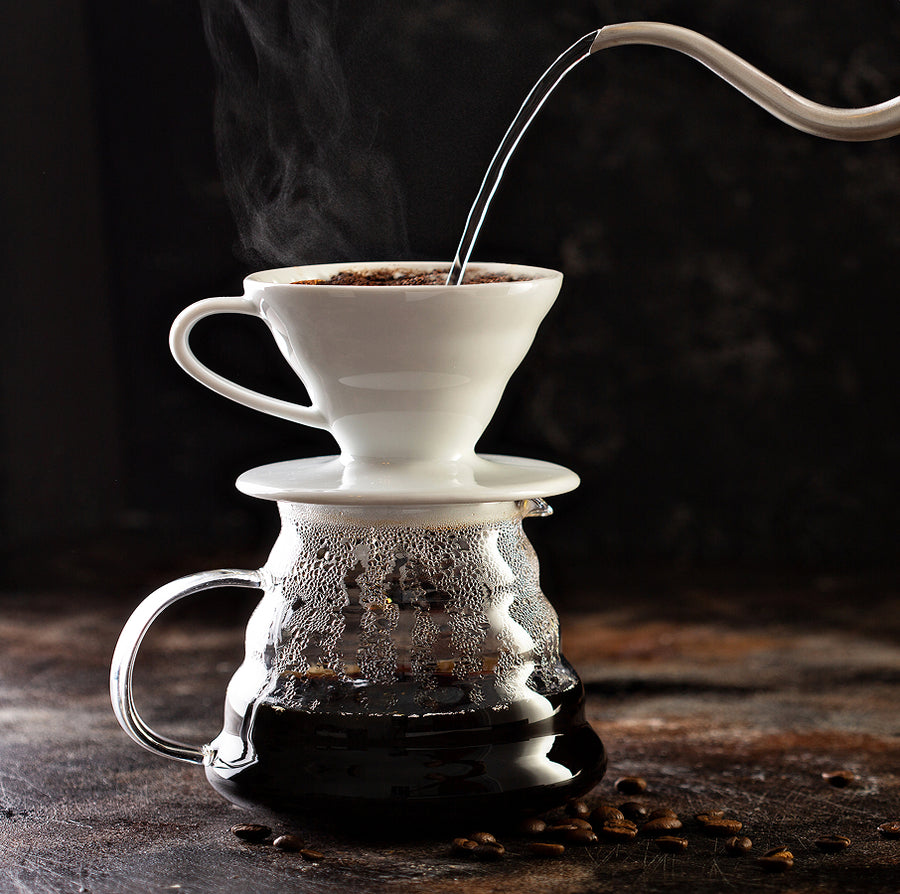 Lifestyle shot of Aeropress brewing Danger Coffee for fresh, mold-free clean energy