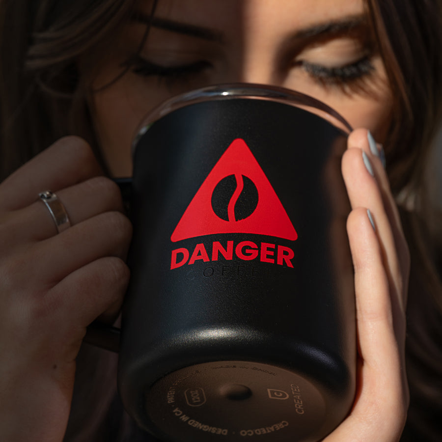 Lifestyle shot of Aeropress brewing Danger Coffee for fresh, mold-free clean energy