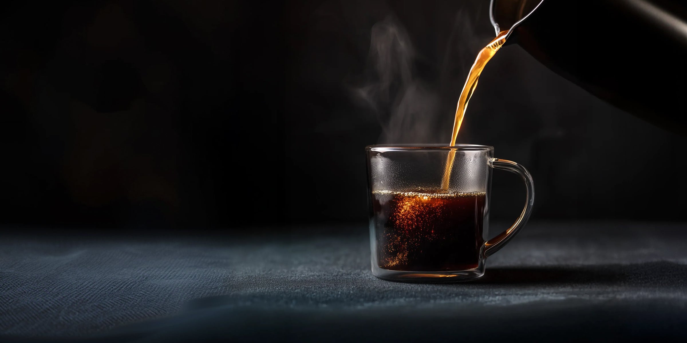 Overhead shot of hands holding black coffee beside a Danger Coffee bag with red triangle logo.